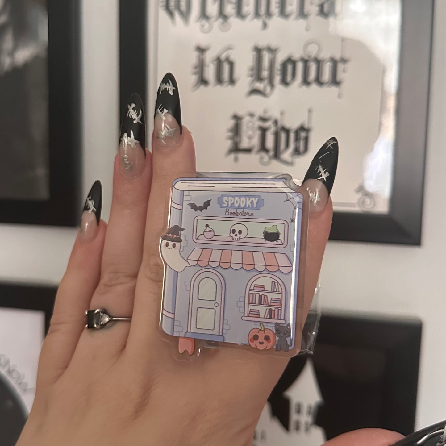 Spooky bookstore MagSafe e-reader grip